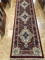 Full view of the rug runner showing length and pattern on the floor.