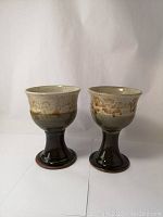 Pair of Donn Zver pottery wine goblets side by side, showing full height and shape.