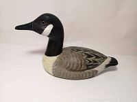 Front side view showing head profile and body feather carving