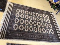 Full top view of the rectangular antique Persian style rug showing overall pattern and colors.