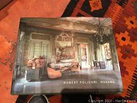 Cover of the photography book 'Robert Polidori Havana' showing an interior space with faded walls and vintage furniture.