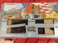 Box of Bachmann The American train set with visible branding and graphics showing the train and details about the E-Z Track System