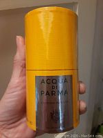 Front view of the yellow cylindrical packaging showing the Acqua Di Parma Colonia Intensa label and size of 3.4 fl oz.