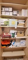 Shelving unit with various packaged bedding and accessories