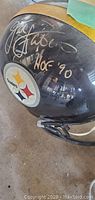 Side view of helmet showing Jack Lambert autograph and HOF ’90 inscription