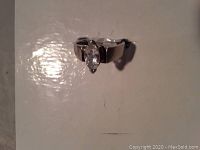 Overhead front view showing marquise-shaped gemstone and band