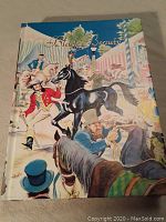 Front cover of the 1945 edition of Black Beauty book with colorful illustrations of horses and humans.