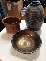 Large vase, bowl, and planter arranged together showing shapes and finishes