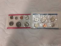 Two 1980 US Mint Sets from Denver and Philadelphia, sealed plastic holders with seven uncirculated coins each.