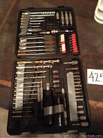 Open black case showing the full Craftsman drill bit set layout with bits organized by type and size.