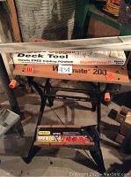 Workmate 200 work table overall view with Bowrench deck tool in original box on top, showing orange handles and text.