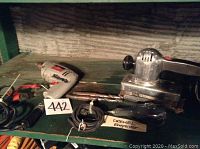 Photo showing Dremel engraver, Ram sander, drill bits, and part of the Skil drill