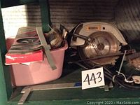 Photo of the Craftsman 7 inch circular saw with visible blade and accessories stored in pink bin.