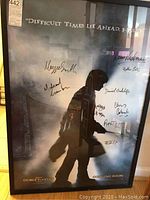 Full front view of framed poster showing overall design and signatures