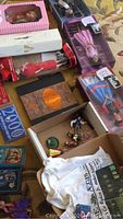 Overview of lot showing open box with small figurines, Cal Ripken T-shirt, book, coins and cards