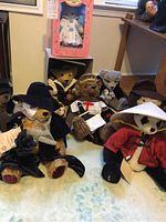 Eight Hermann/Gumps limited edition collectible teddy bears, including one in pink display box and seven unpackaged bears dressed in various costumes