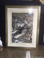 Full view of framed wolf and cubs picture showing overall good condition and size.