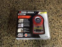 Front view of Black & Decker Bullseye digital level and angle finder in sealed clear plastic package showing product, branding, and features.