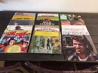 16 original vinyl albums displayed in 3 rows, showing a variety of artists and music genres.