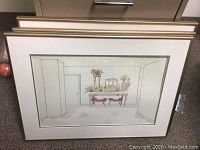 Framed painting of a dining room scene with two red chairs and table with flowers and mirror, matted and framed