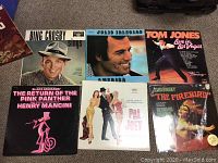 Collection of vintage vinyl record albums showing covers by Bing Crosby, Julio Iglesias, Tom Jones, Henry Mancini, Stravinsky, and others