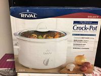 Front view of Rival Crock-Pot Select 4-quart slow cooker box showing product image and features.