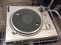 Top view of Dual CA 607 turntable showing platter and tonearm, no needle present
