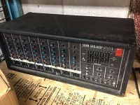 Front view of Sunn SR8300P mixer showing all channel strips and overall housing