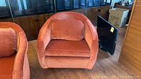 Front view showing the full seat, armrests, and back with the cushion inside the chair.