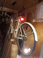 Side view of the white All Pro bicycle showing rear reflector and 26-inch wheel with fender.