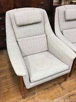 Full front view showing overall style, headrest and lumbar cushion.