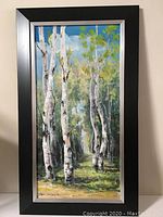 Framed vertical oil painting of white birch trees with bright sky and forest background.