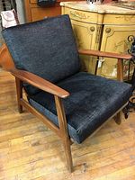 Front three-quarter view of chair showing overall design and new upholstery