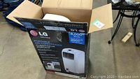 Original box showing LG branding, 8000 BTU cooling capacity, and 200 sq ft cooling coverage.