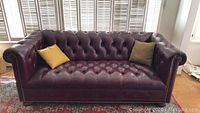 Front view of the couch with two throw pillows