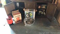 Wide view of new kitchen items including copper kettle, mixing bowls, whistling kettle, and boxed items.