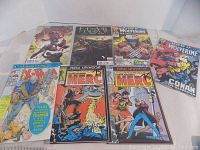 Photo showing all seven Marvel comic books laid out, including Fear Itself, two Wolverine comics, X-Men, and three Merc comics.