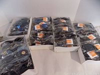 View of all 5 boxes filled with individually packaged new sunglasses, showing quantity and packaging.