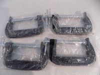 Four new 4-inch C clamps in black coating with silver screw mechanisms wrapped in plastic.