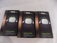Image showing three new boxed Duracell Power On The Go Power Mats, packaging displays device image and features.