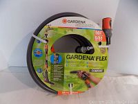 Front view of packaged Gardena Flex 50ft garden hose showing brand and features on label.