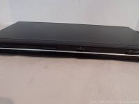 Front top view of black Toshiba DVD player