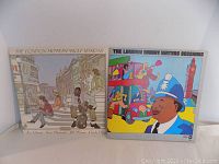 Photo showing the front covers of the two vinyl albums, The London Howlin' Wolf Sessions and The London Muddy Waters Sessions, placed side by side.