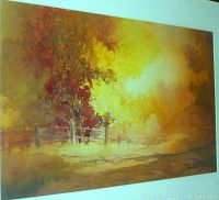 Frontal view of the full watercolor painting inside silver frame showing autumn landscape and wooden fence.