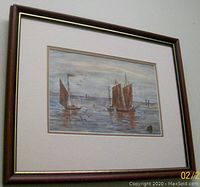 Framed watercolor painting showing marine scene with ships and birds, viewed straight-on.