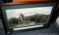 Framed military print titled 'The Return from Inkerman' showing detailed grayscale soldiers marching with mounted officer in front.