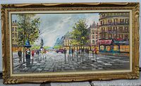 Full front view of large framed painting showing Paris street scene with pedestrians, buildings, trees, and a statue in the background.