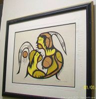 Front angled view of framed artwork showing the print, signature, matte, and damaged frame areas.