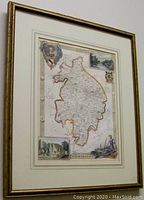 Framed hand-coloured engraved map of Warwickshire showing full map and surrounding details.