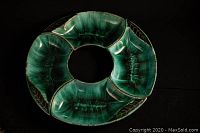 Four vintage Blue Mountain pottery serving bowls arranged in a circle showing the blue-green glaze and shape